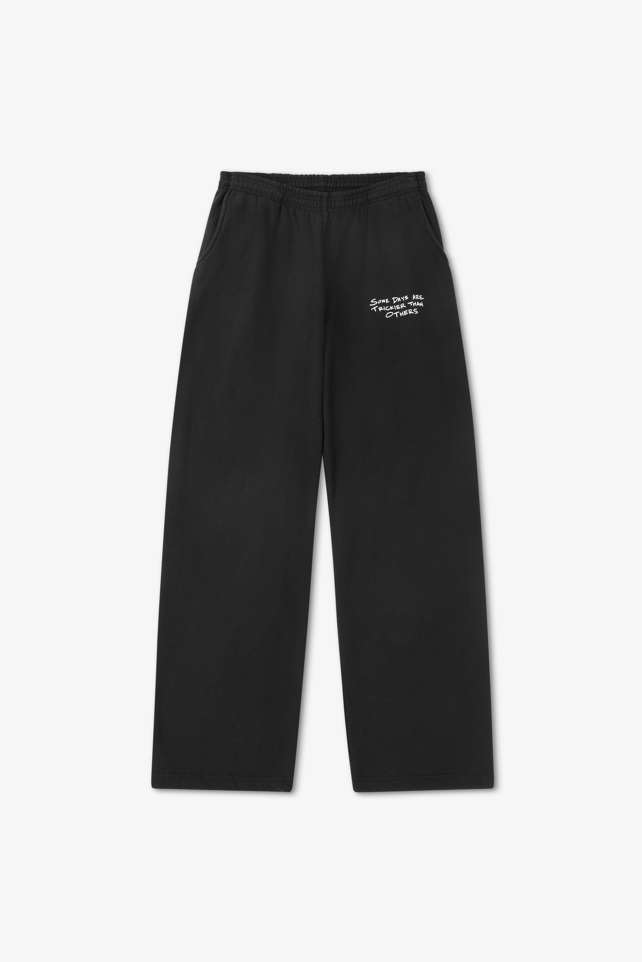 Black pants with text on a white background
