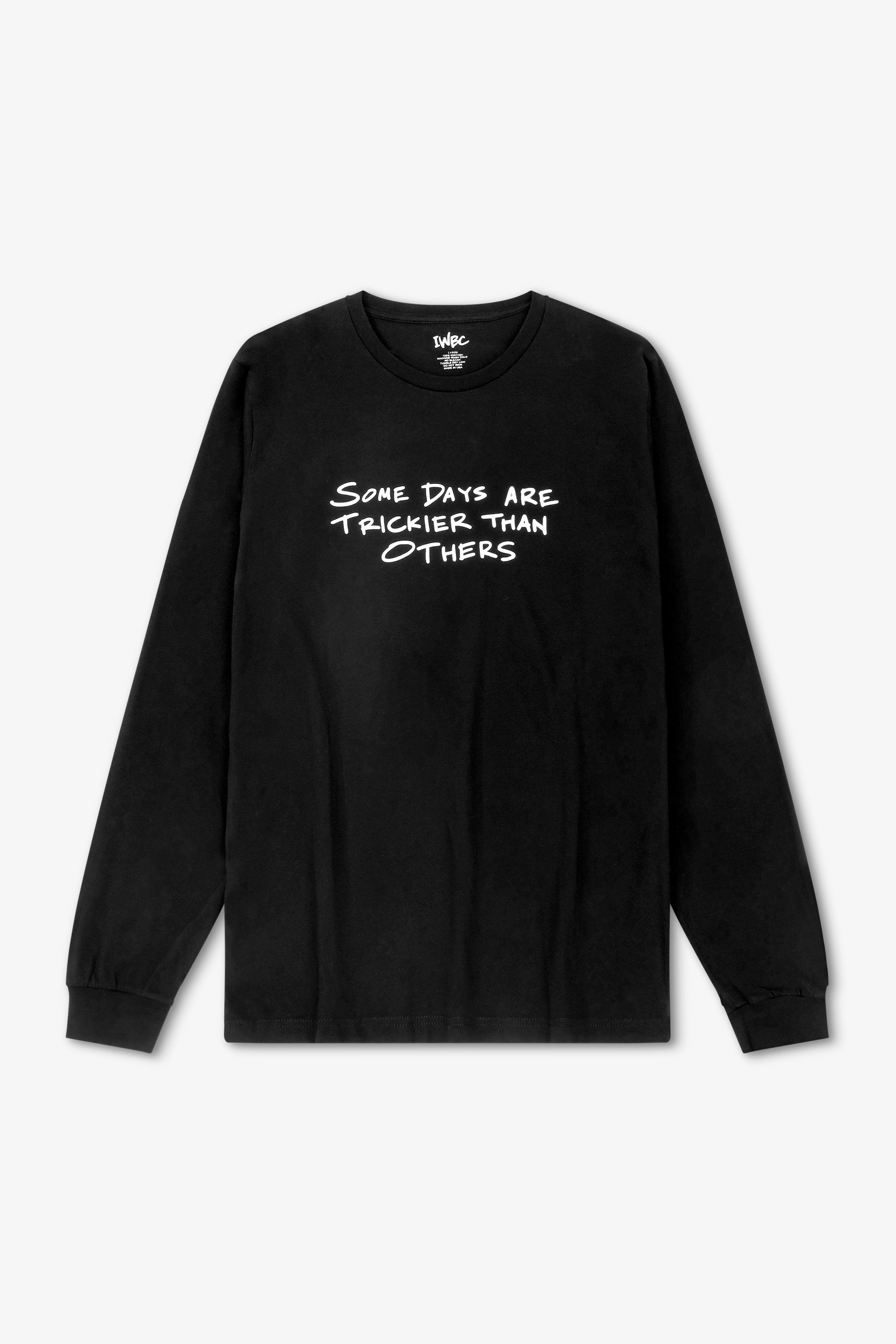 Black long-sleeve shirt with white text on a light gray background