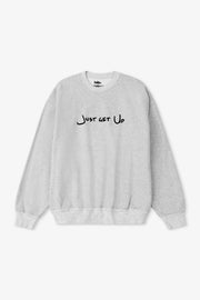 Gray sweatshirt with 'Just Get Up' text on a white background