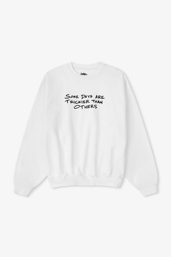 White sweatshirt with black text on a white background
